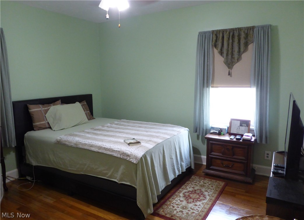496 Babbitt Road Euclid, OH 44123 - Photo 12 of 31 First Floor Bedroom with Hardwood Flooring, Ceiling Fan, and Large Closet!