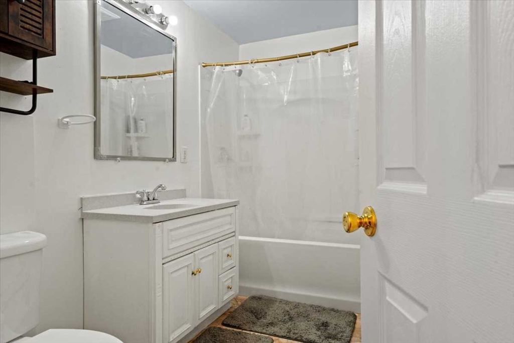 3 Wallace Street Worcester, MA 01605 - Photo 16 of 29 a bathroom with a sink toilet and vanity