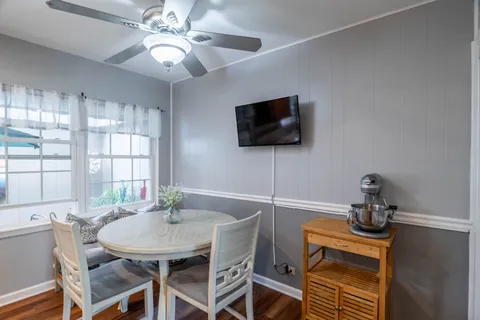 a dining room with furniture and window