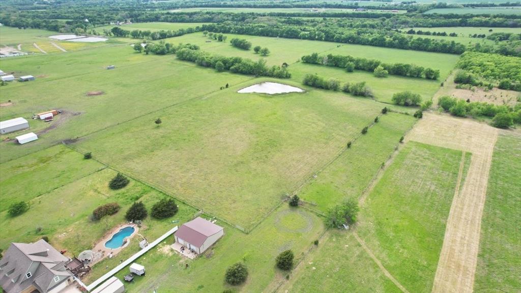 99 East Line Road Whitewright, TX 75491 - Photo 10 of 10 a view of a swimming pool with a yard