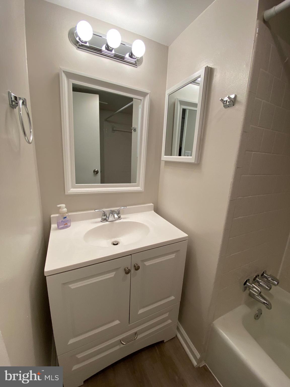 17824 Buehler Road, Unit 188 Olney, MD 20832 - Photo 16 of 21 Hall bathroom with tub and new vanity