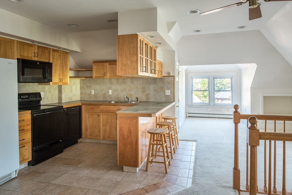 78 Winthrop Road Brookline, MA 02445 - Photo 11 of 14 a kitchen with sink and refrigerator