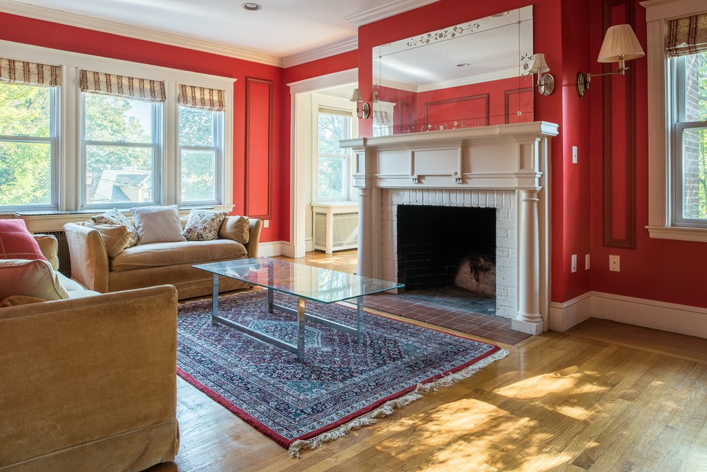 78 Winthrop Road Brookline, MA 02445 - Photo 2 of 14 a living room with furniture and a fireplace