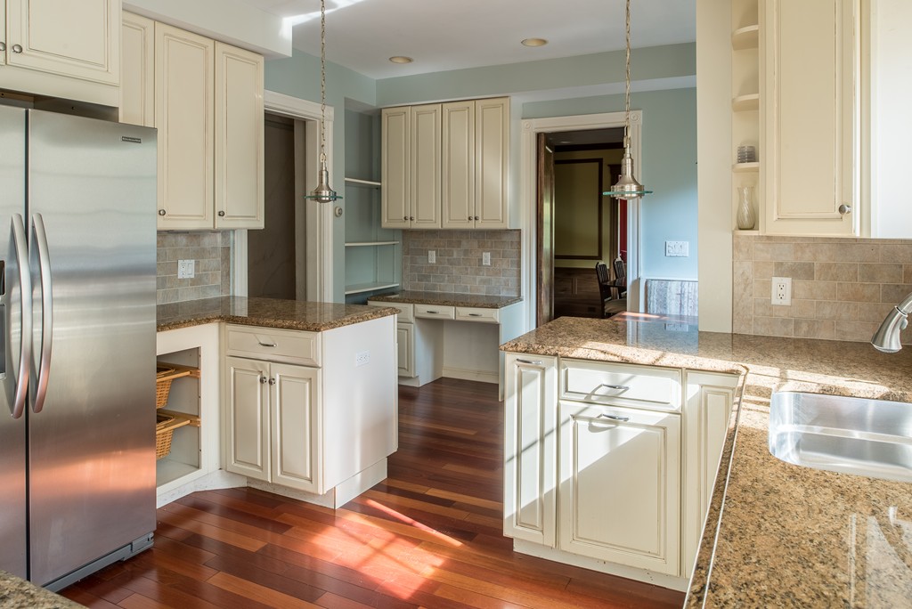 78 Winthrop Road Brookline, MA 02445 - Photo 5 of 14 a kitchen with stainless steel appliances granite countertop a refrigerator a stove and a sink with cabinets