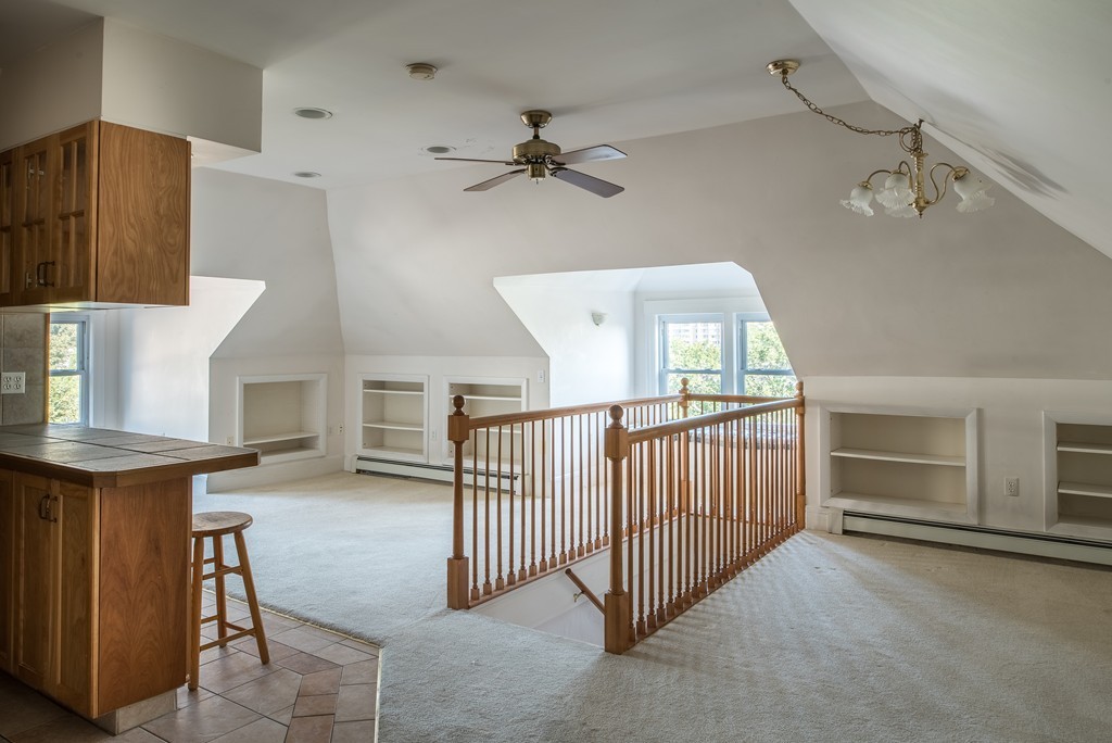 78 Winthrop Road Brookline, MA 02445 - Photo 10 of 14 a view of a livingroom with furniture and a ceiling fan