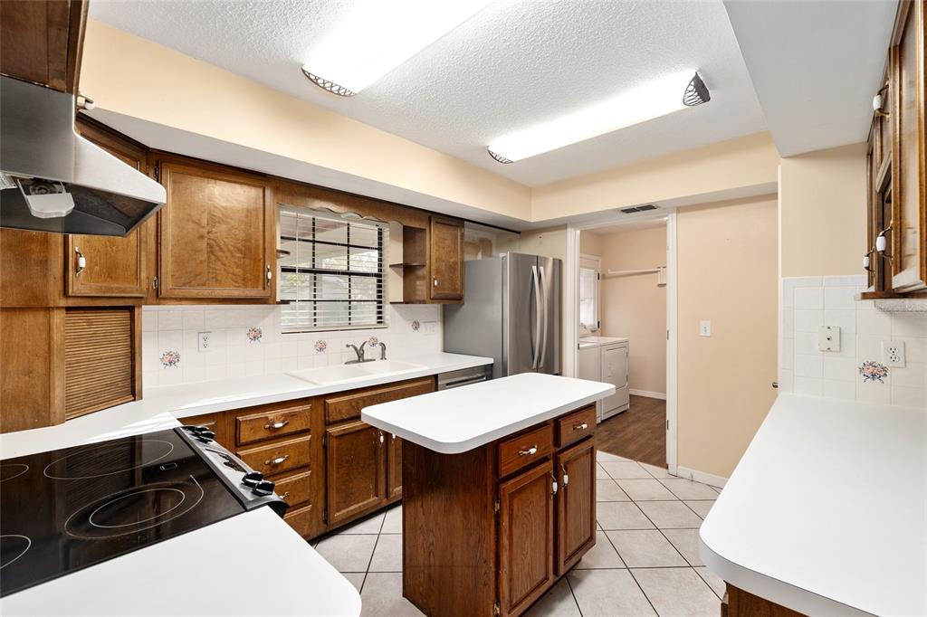 3300 Southeast 32nd Street Ocala, FL 34471 - Photo 15 of 51 a kitchen with a sink appliances and cabinets