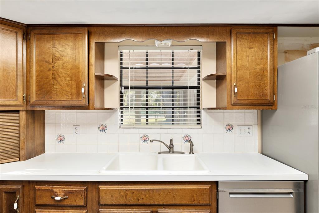 3300 Southeast 32nd Street Ocala, FL 34471 - Photo 17 of 51 a kitchen with a sink and a window