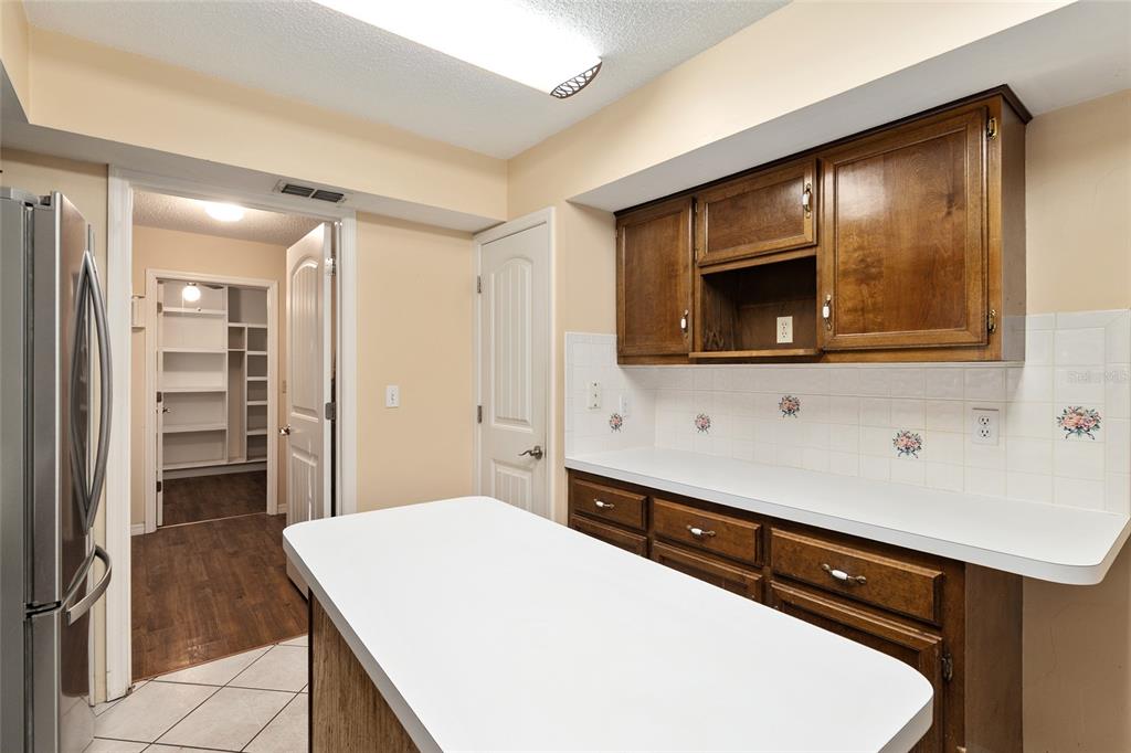 3300 Southeast 32nd Street Ocala, FL 34471 - Photo 19 of 51 a kitchen with a sink and a refrigerator