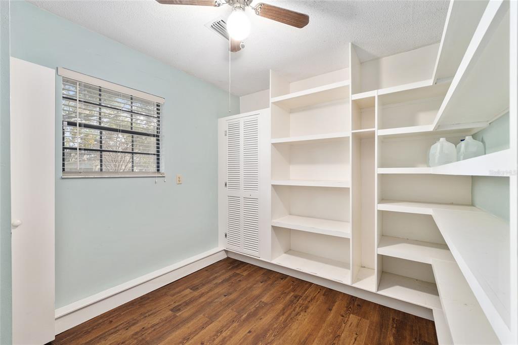 3300 Southeast 32nd Street Ocala, FL 34471 - Photo 20 of 51 a view of an empty room with a window and wooden floor