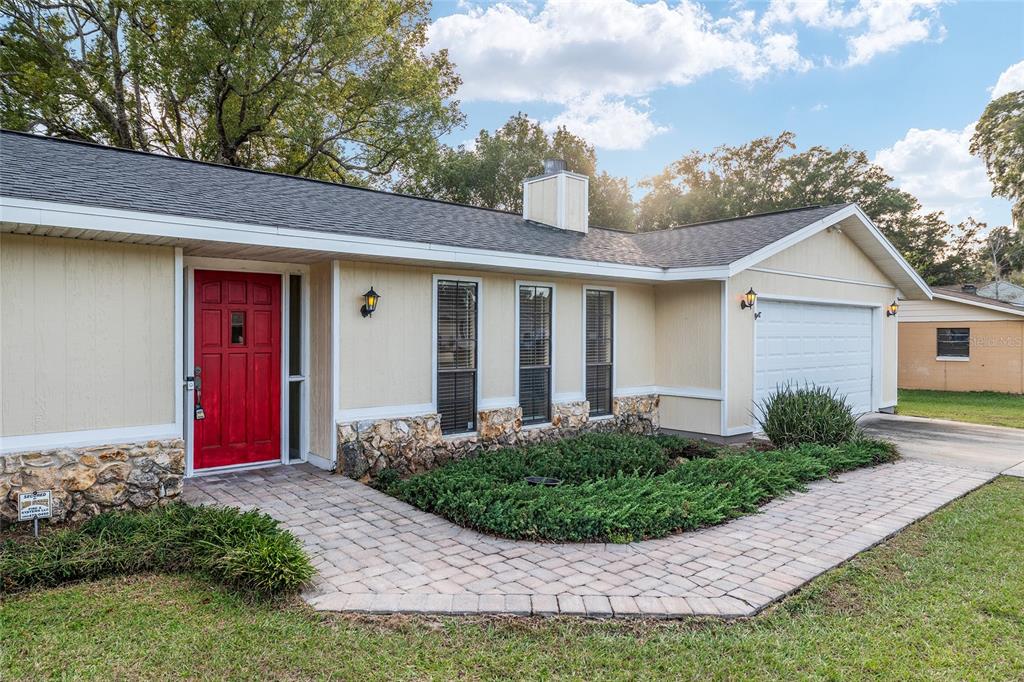 3300 Southeast 32nd Street Ocala, FL 34471 - Photo 2 of 51 a front view of a house with a yard