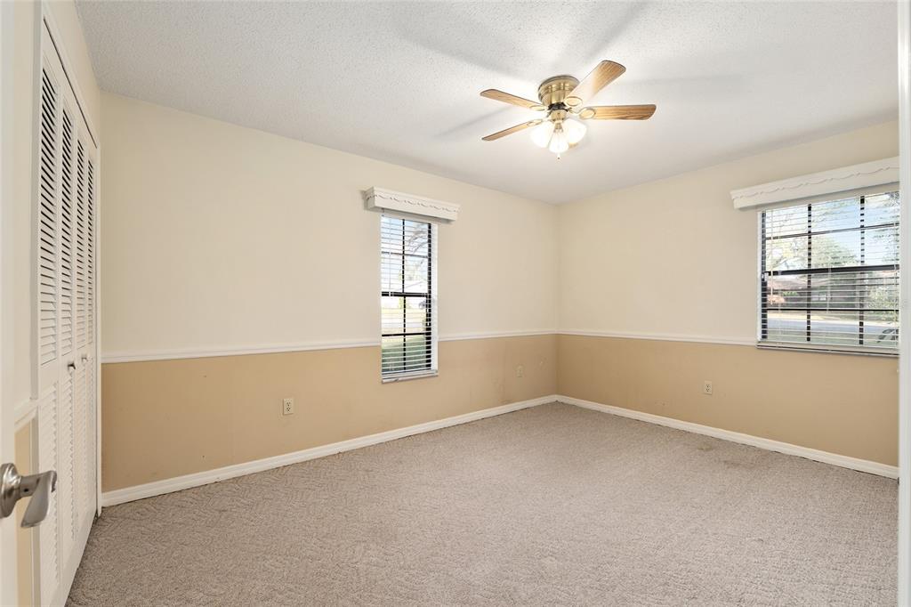 3300 Southeast 32nd Street Ocala, FL 34471 - Photo 28 of 51 an empty room with windows and fan