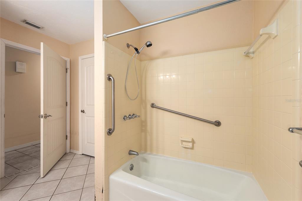 3300 Southeast 32nd Street Ocala, FL 34471 - Photo 32 of 51 a bathroom with a bathtub and a shower