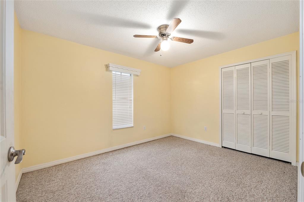 3300 Southeast 32nd Street Ocala, FL 34471 - Photo 34 of 51 an empty room with windows and fan