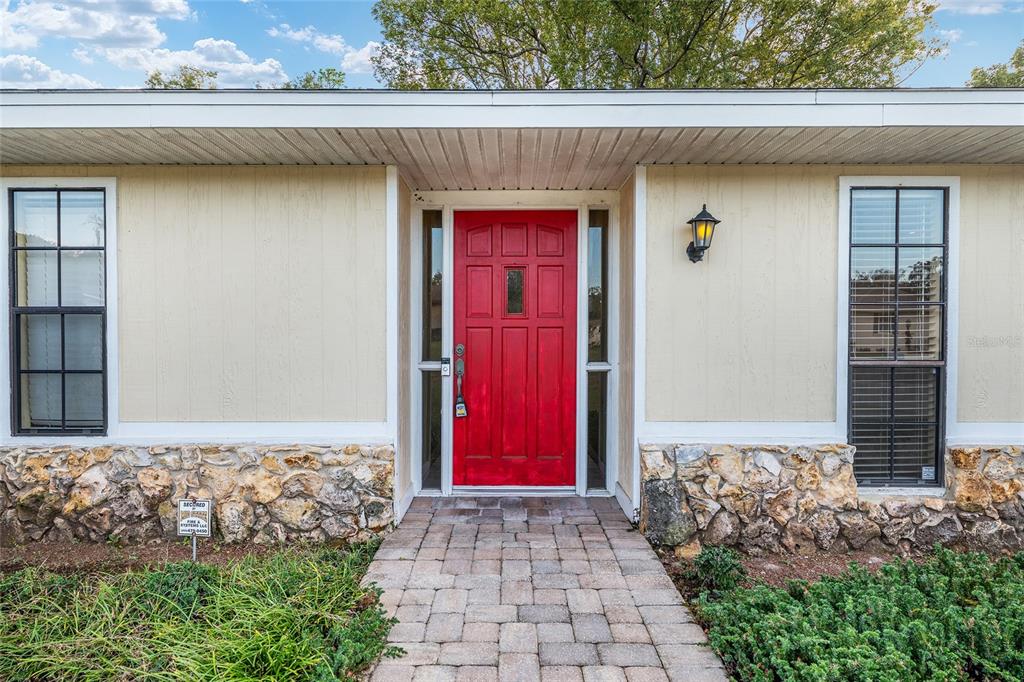 3300 Southeast 32nd Street Ocala, FL 34471 - Photo 4 of 51 a front view of a house with red gate