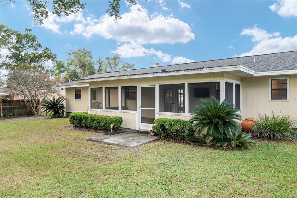 3300 Southeast 32nd Street Ocala, FL 34471 - Photo 41 of 51 a view of a house with a yard and potted plants