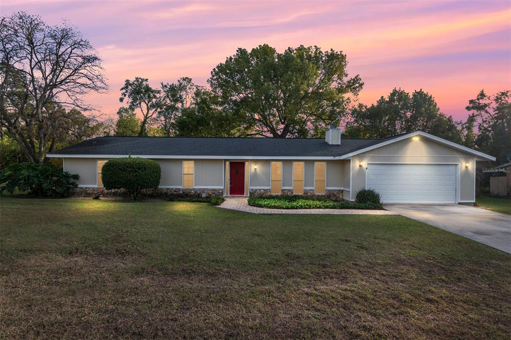 3300 Southeast 32nd Street Ocala, FL 34471 - Photo 48 of 51 a front view of a house with garden