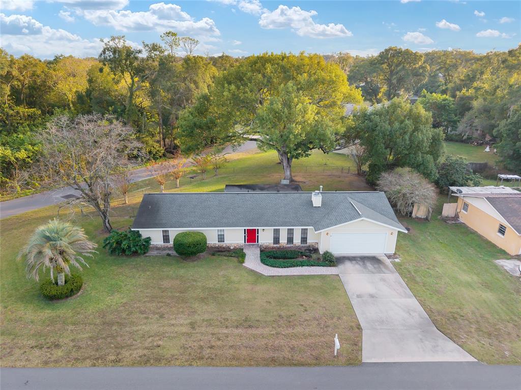 3300 Southeast 32nd Street Ocala, FL 34471 - Photo 49 of 51 an aerial view of residential houses with outdoor space and trees