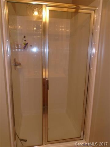 1512 Calvin Hall Road, Unit 161 Lake Wylie, SC 29710 - Photo 15 of 24 a bathroom with a glass shower door