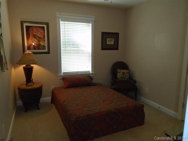 1512 Calvin Hall Road, Unit 161 Lake Wylie, SC 29710 - Photo 18 of 24 a bedroom with a bed and window