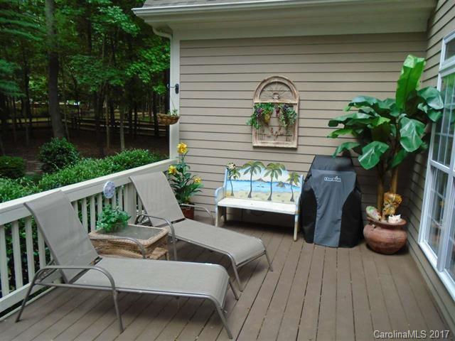 1512 Calvin Hall Road, Unit 161 Lake Wylie, SC 29710 - Photo 23 of 24 a view of a balcony with two chairs and a potted plant