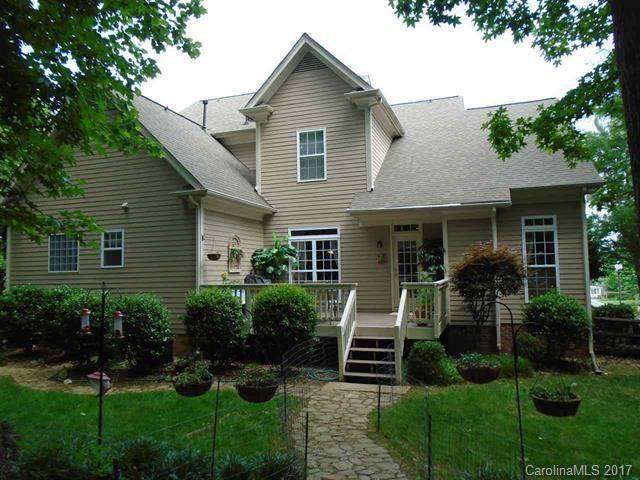 1512 Calvin Hall Road, Unit 161 Lake Wylie, SC 29710 - Photo 24 of 24 a front view of a house with garden and porch