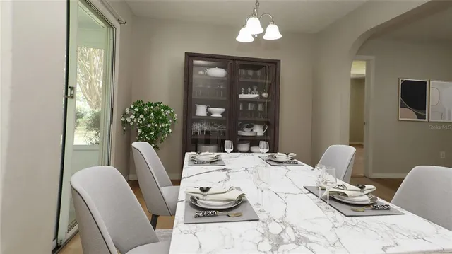 a view of a dining room with furniture window and outside view