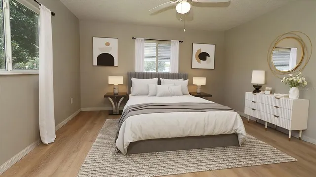 a bedroom with a large bed and a window