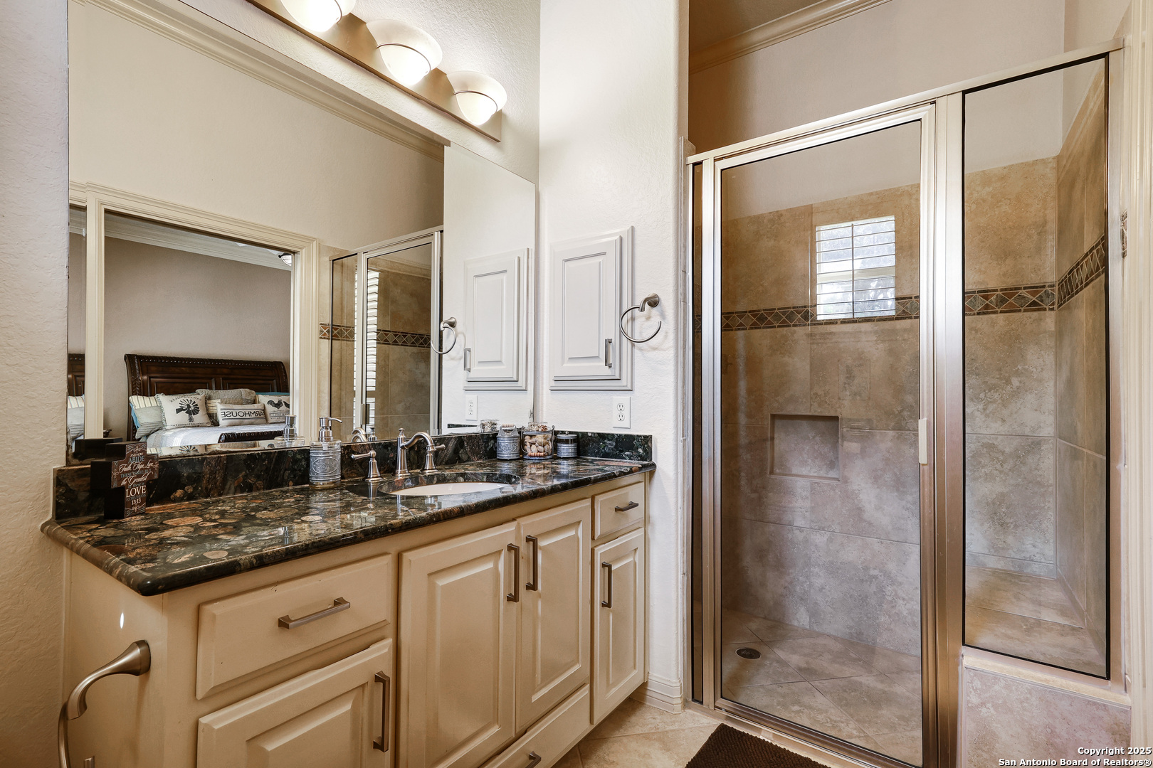 315 Santa Domingo Helotes, TX 78023 - Photo 30 of 50 a bathroom with a granite countertop sink a mirror and a shower