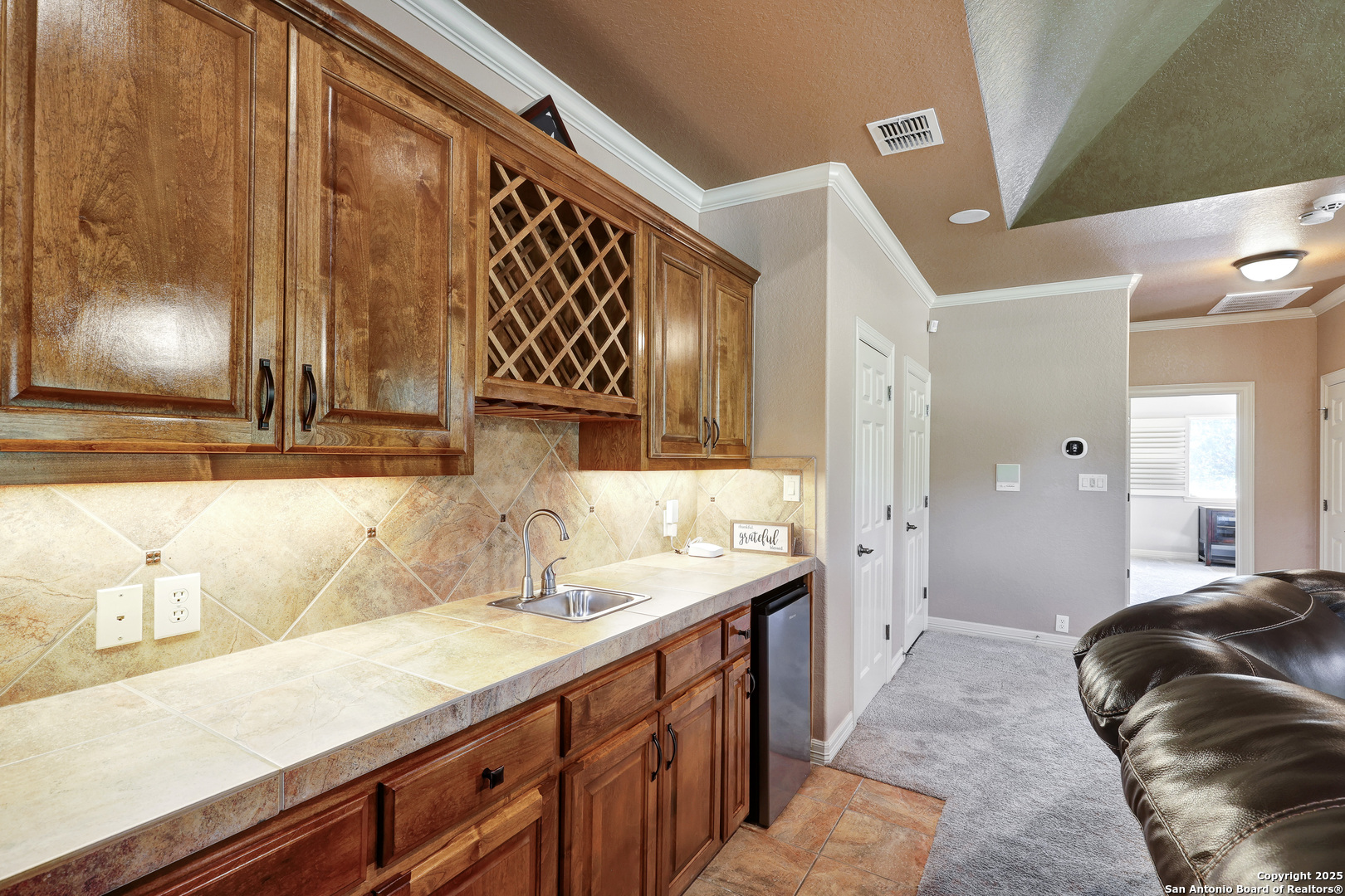 315 Santa Domingo Helotes, TX 78023 - Photo 32 of 50 a bathroom with a sink and a mirror