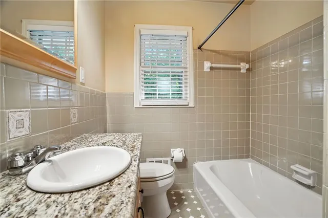 a view of a house with backyard porch and sitting area
