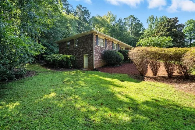 a picture of a bathroom with a shower