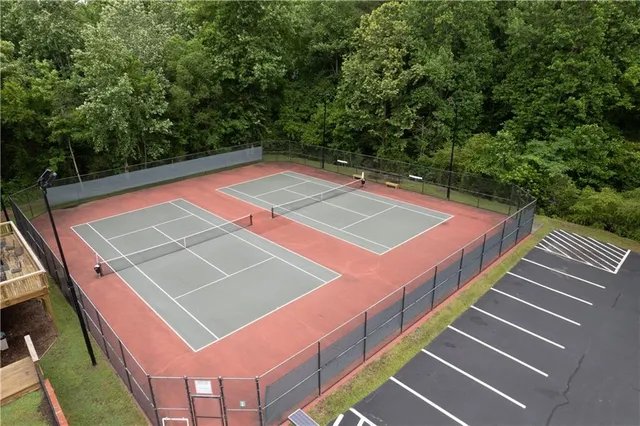 a view of a backyard with swimming pool