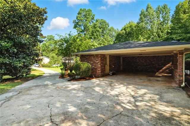 a view of a house with a yard and garage