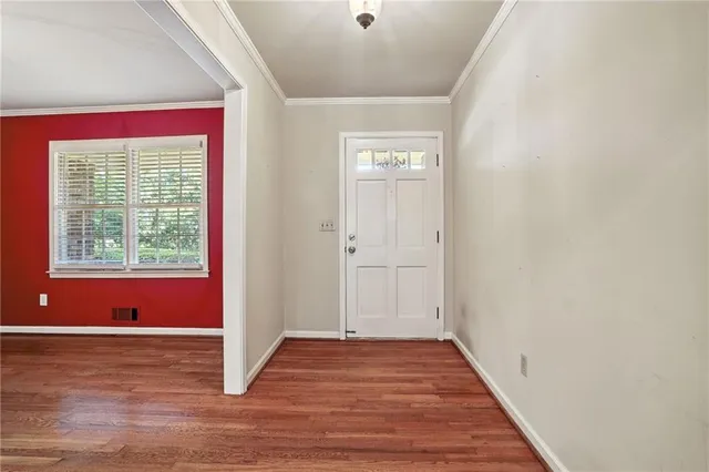 a view of a livingroom with wooden floor