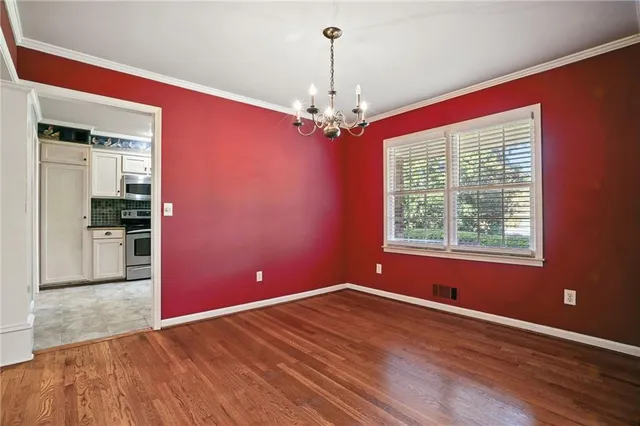 a view of livingroom with window hardwood floor and a ceiling fan