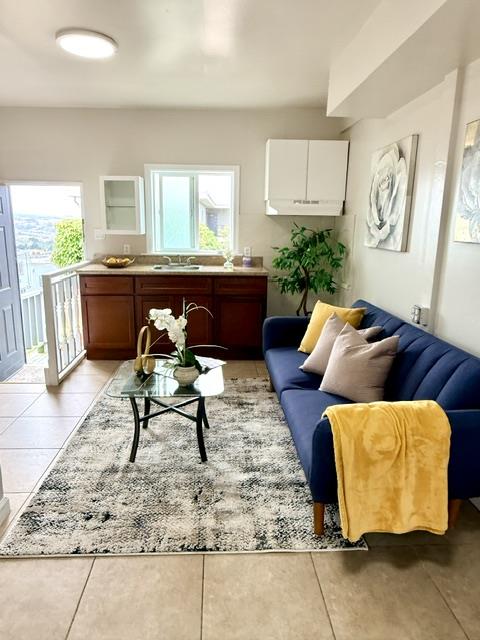 135 Bepler Street Daly City, CA 94014 - Photo 15 of 34 a living room with furniture and a rug