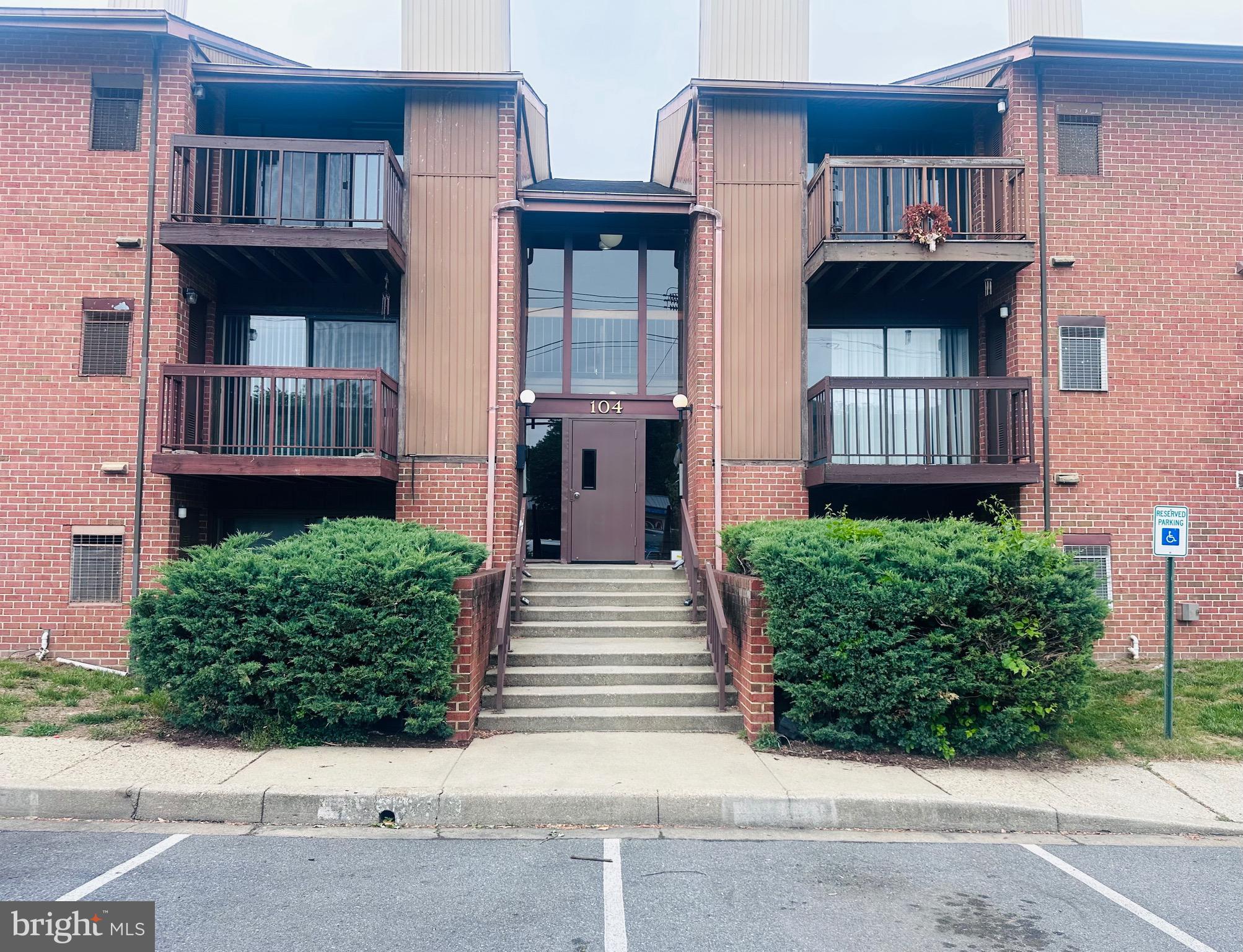 104 Mountain Road, Unit 1A Glen Burnie, MD 21060 - Photo 1 of 1 a front view of a house with stairs