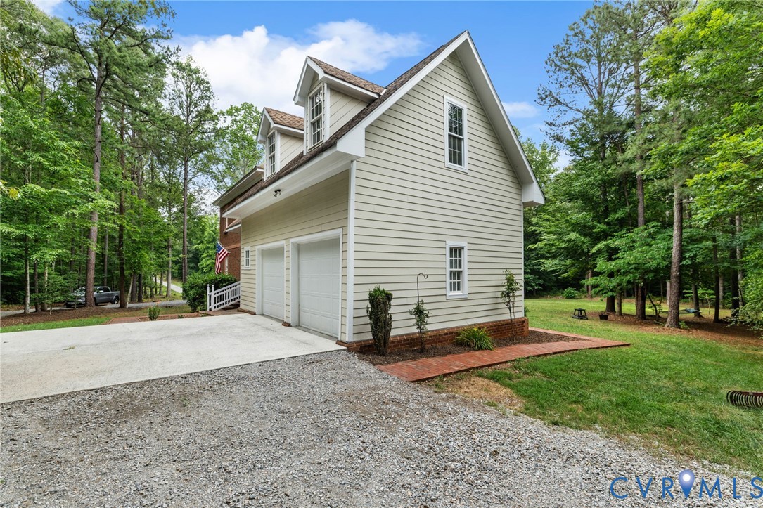 13173 Scotchtown Road Beaverdam, VA 23015 - Photo 58 of 65 a view of a house with backyard and a tree