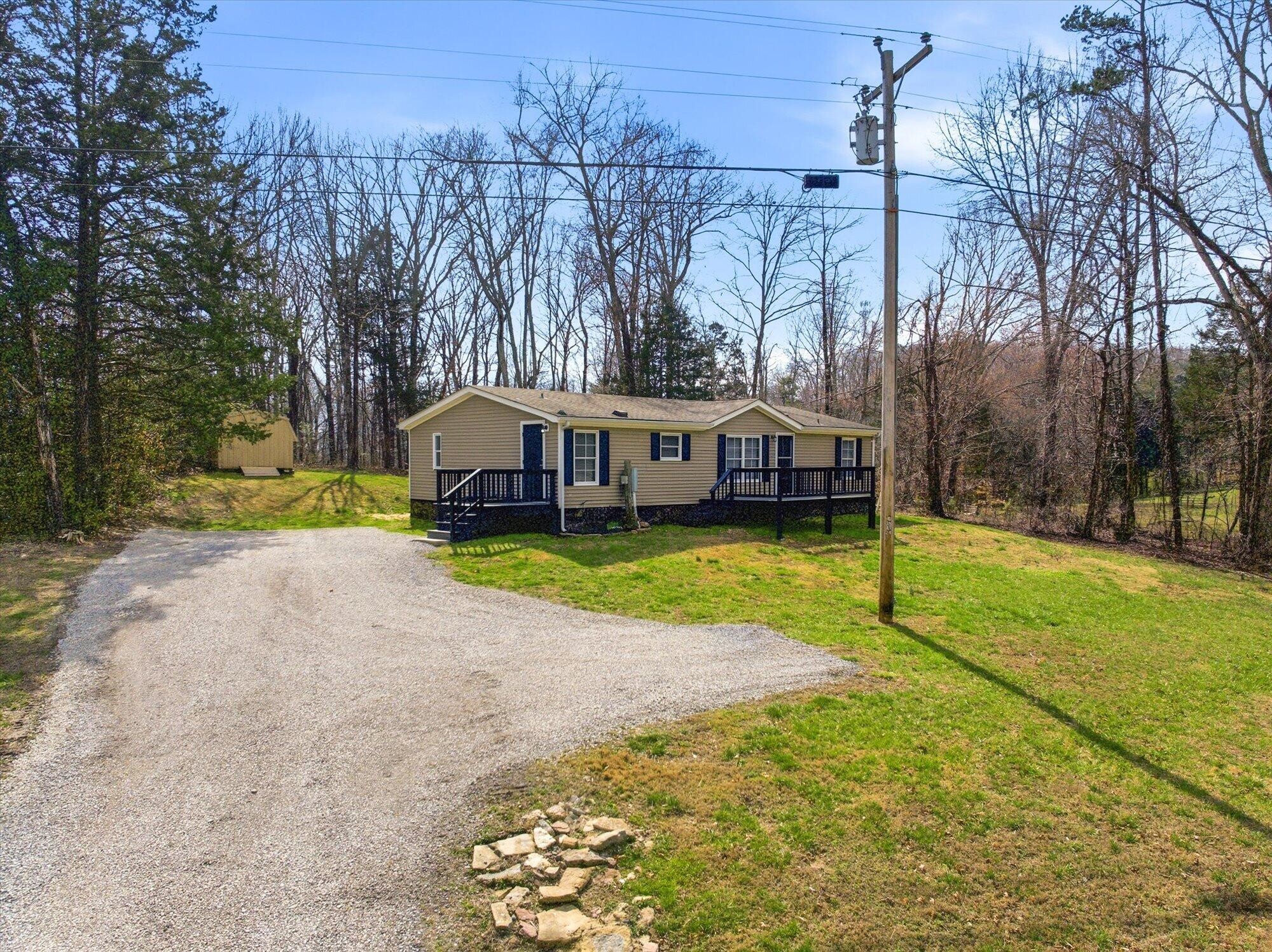64 County Road 100 Decatur, TN 37322 - Photo 2 of 43 a view of house with outdoor space and swimming pool
