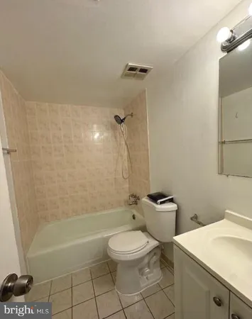 a bathroom with a sink a toilet and a bathtub