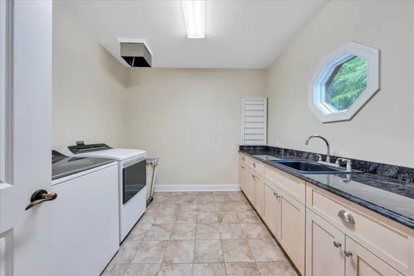 a living room with furniture a rug and a large window