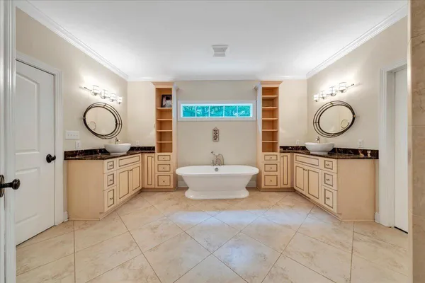 a white toilet sitting next to a bathroom sink