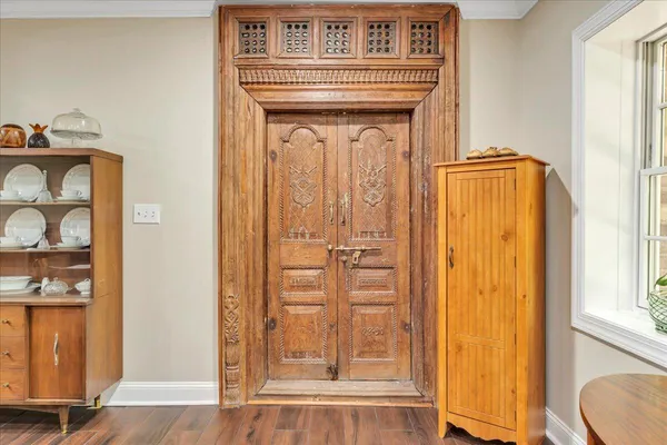 a front view of a house with a yard and a garage