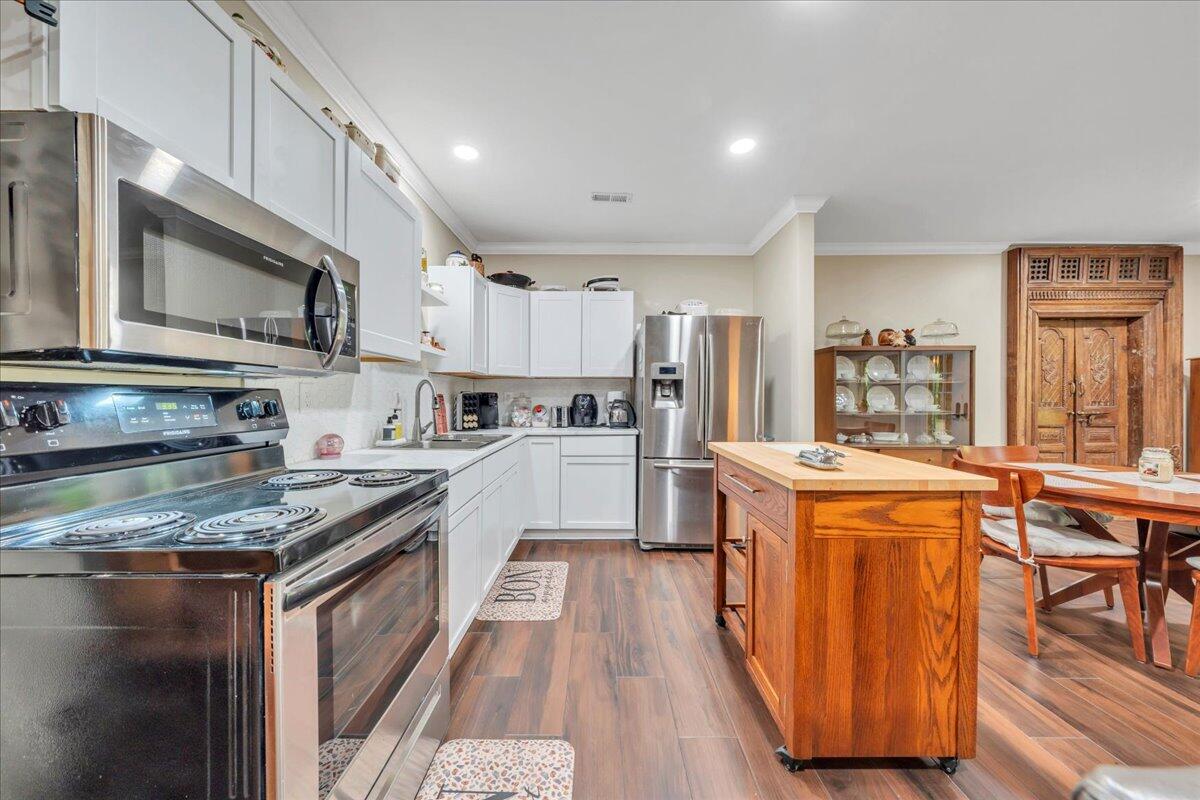 640 Flanders Road Callaway, VA 24067 - Photo 53 of 73 a kitchen with stainless steel appliances granite countertop wooden cabinets a stove top oven a sink and dishwasher