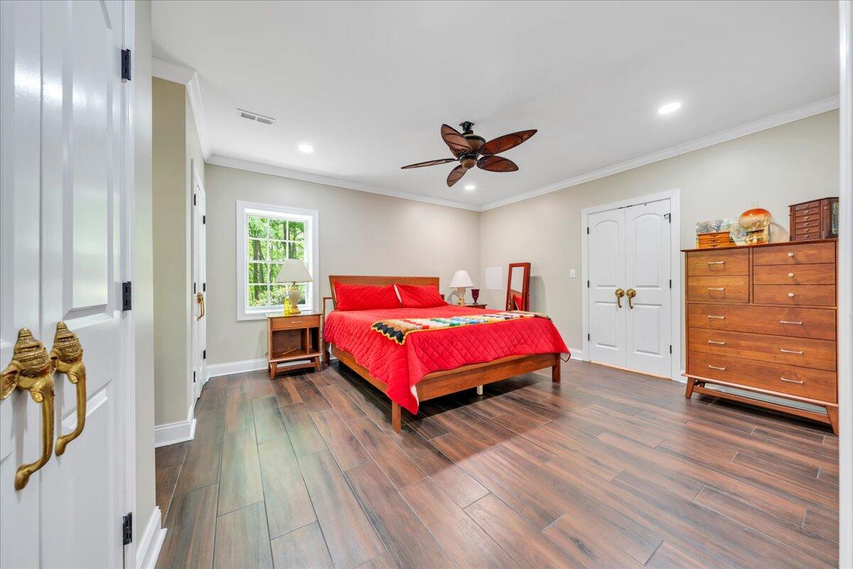 640 Flanders Road Callaway, VA 24067 - Photo 57 of 73 a bedroom with a bed and wooden floor