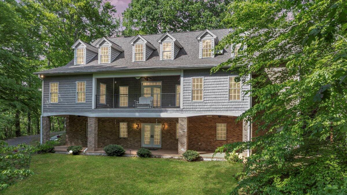 640 Flanders Road Callaway, VA 24067 - Photo 73 of 73 a front view of a house with a garden and plants