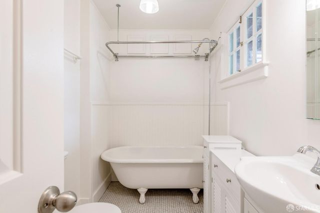 a bathroom with a bathtub and shower