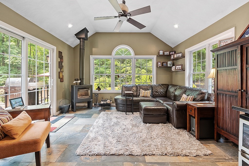 55 Rowley Hill Road Sterling, MA 01564 - Photo 11 of 42 a living room with furniture a window and a chandelier