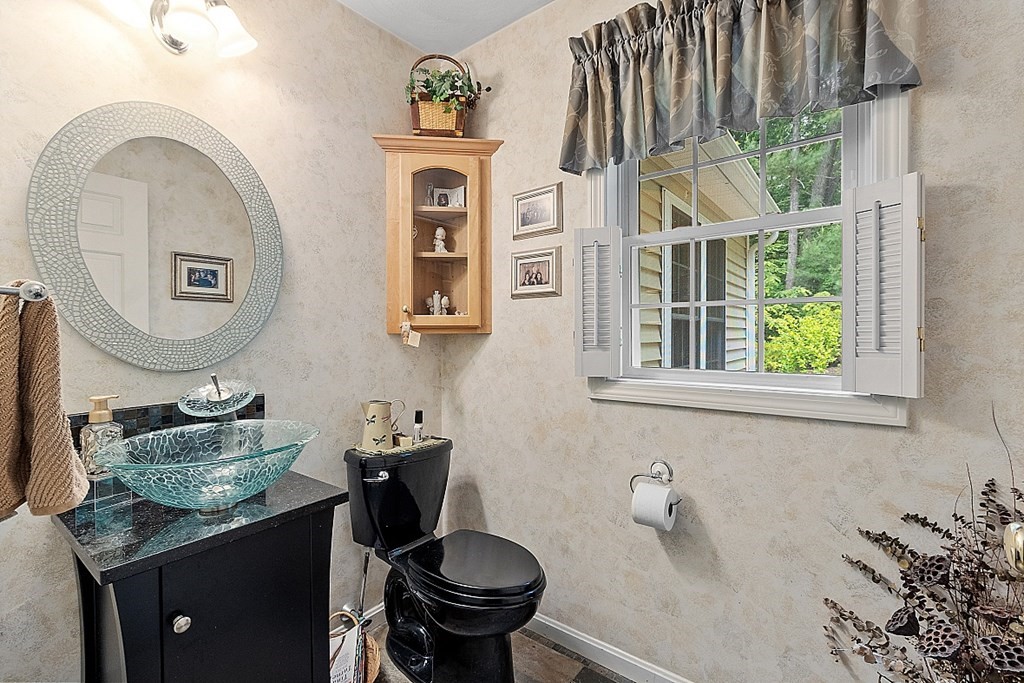 55 Rowley Hill Road Sterling, MA 01564 - Photo 19 of 42 a bathroom with a granite countertop sink and a mirror