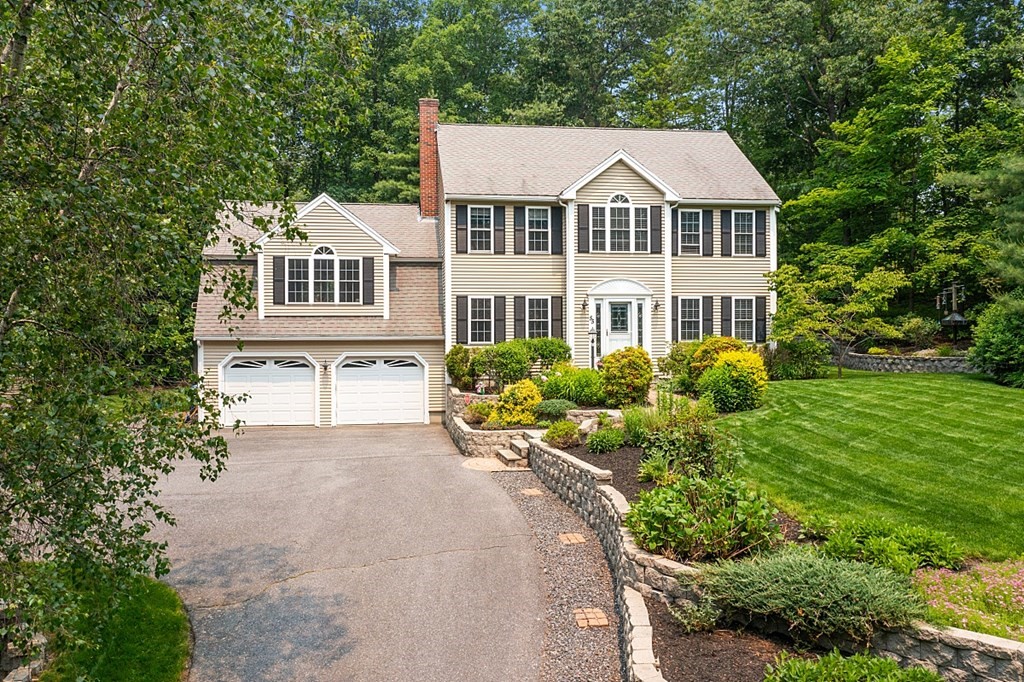 55 Rowley Hill Road Sterling, MA 01564 - Photo 2 of 42 a front view of a house with a yard and green space